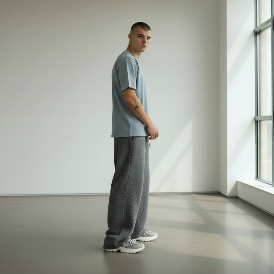 Man standing in a minimalistic room with large windows